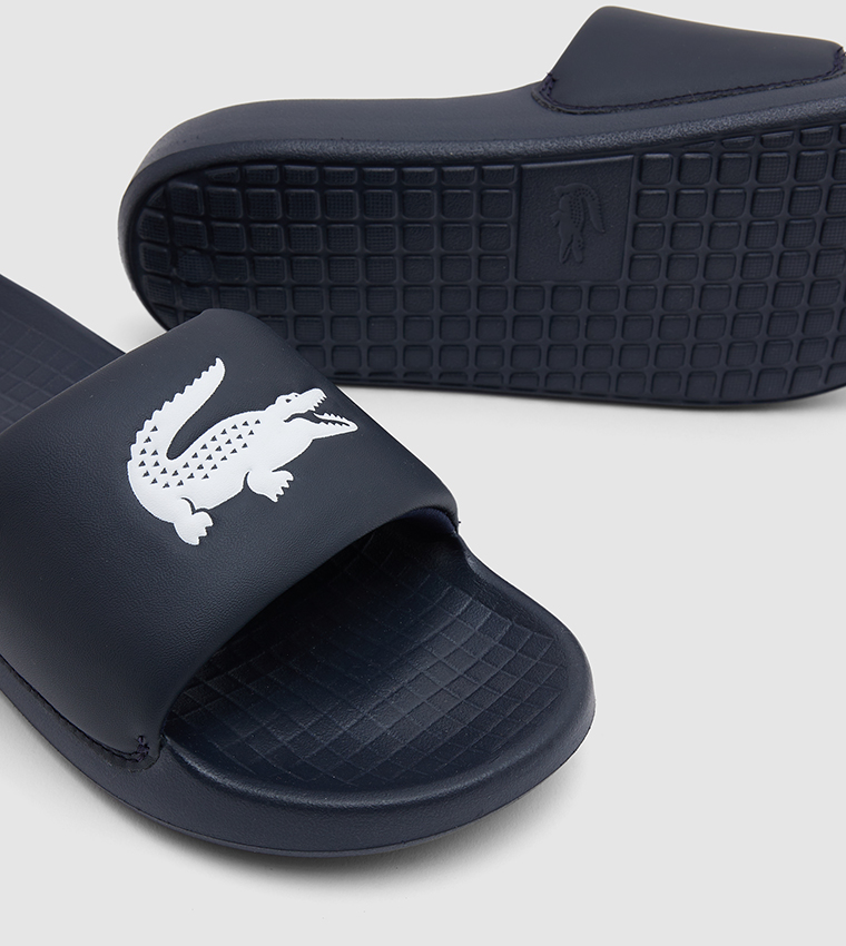 Buy Lacoste Serve Logo Embossed Sliders In Navy Thstreet Saudi Arabia