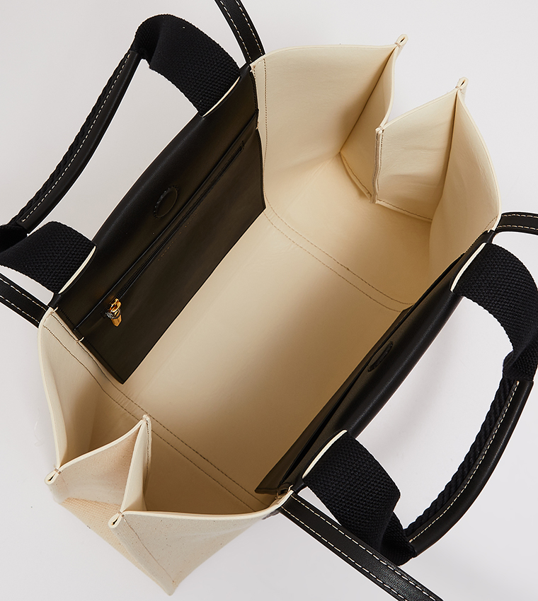 حقيبة كبيرة بمقبض علوي