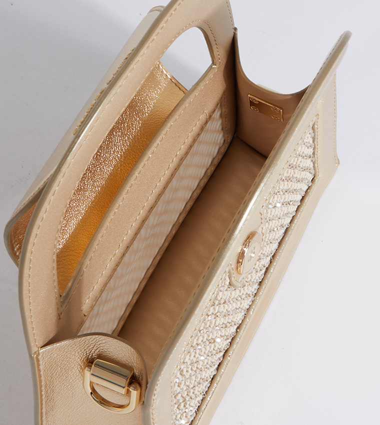 حقيبة صغيرة مزخرفة بشعار العلامة التجارية 