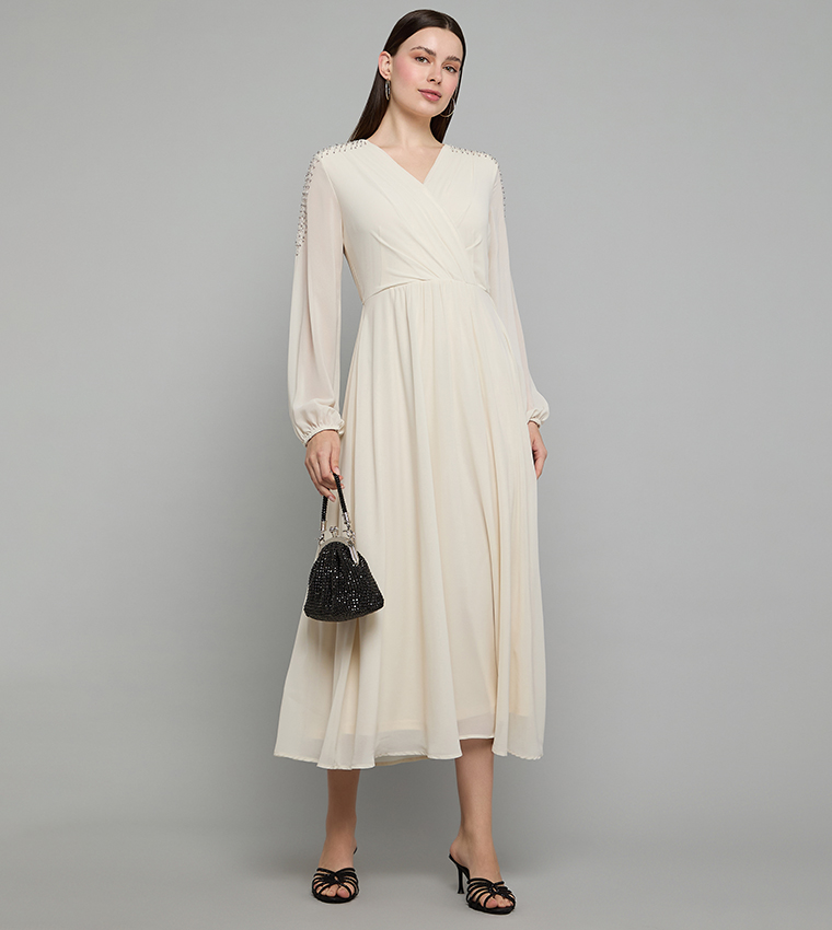 Buy R&B Embellished Flared Dress With Wrap Neck And Long Sleeves In Beige |  6thstreet Oman