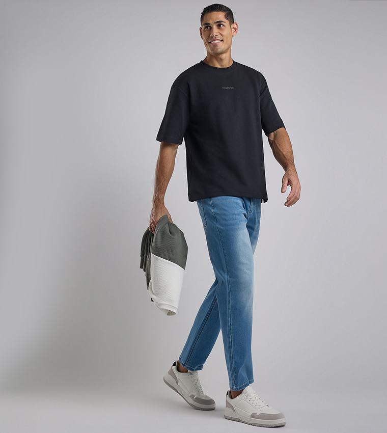 Faded Tapered Fit Jeans with Button Closure