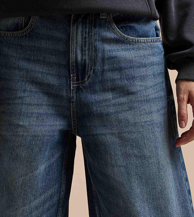 Faded Baggy Jeans with Button Closure