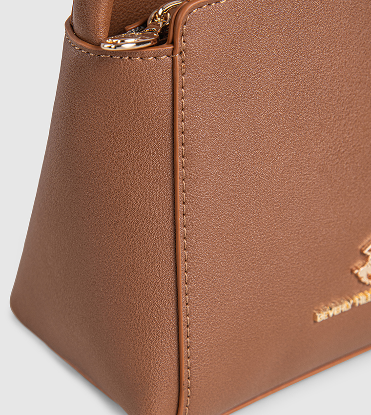 شنطة يد نسائية بشعار 