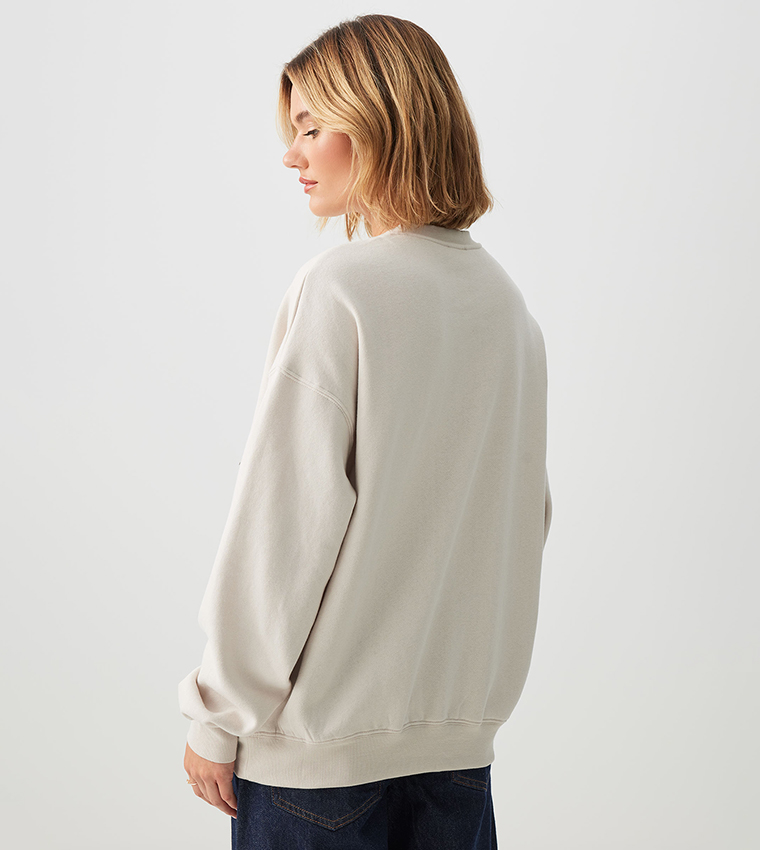 سويتشيرت برقبة مستديرة بجيوب جانبية