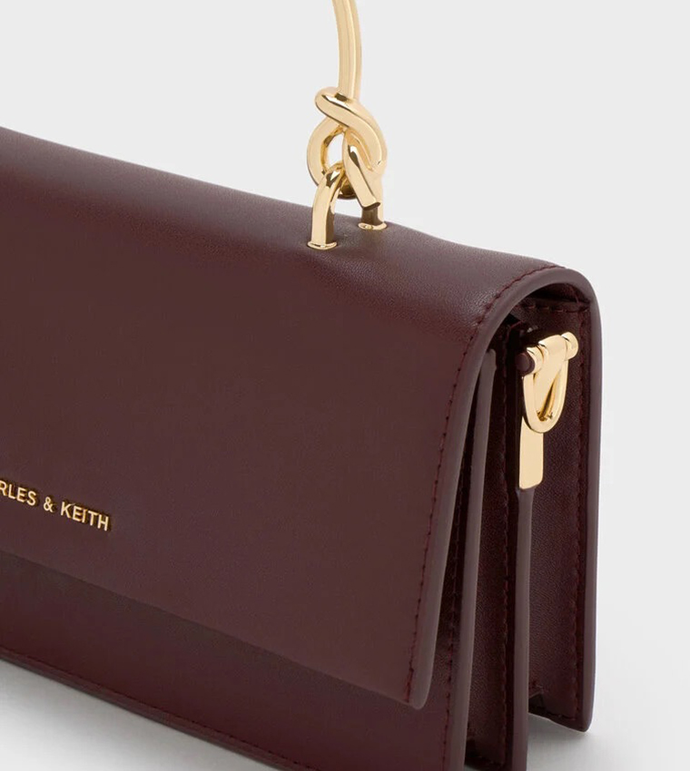 شنطة يد بشعار