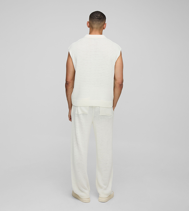 تيشيرت بولو واسع بدون أكمام بنسيج مرن