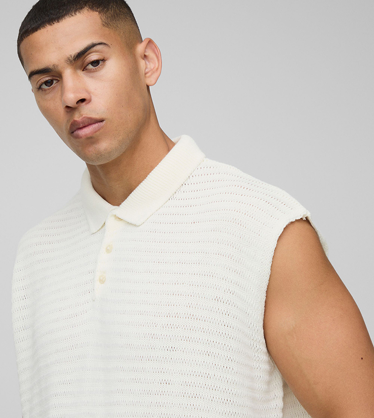 تيشيرت بولو واسع بدون أكمام بنسيج مرن