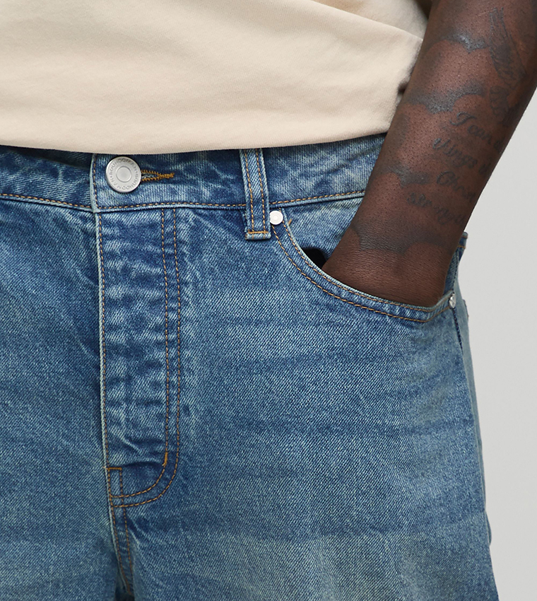 Washed Mid Rise Flared Jeans