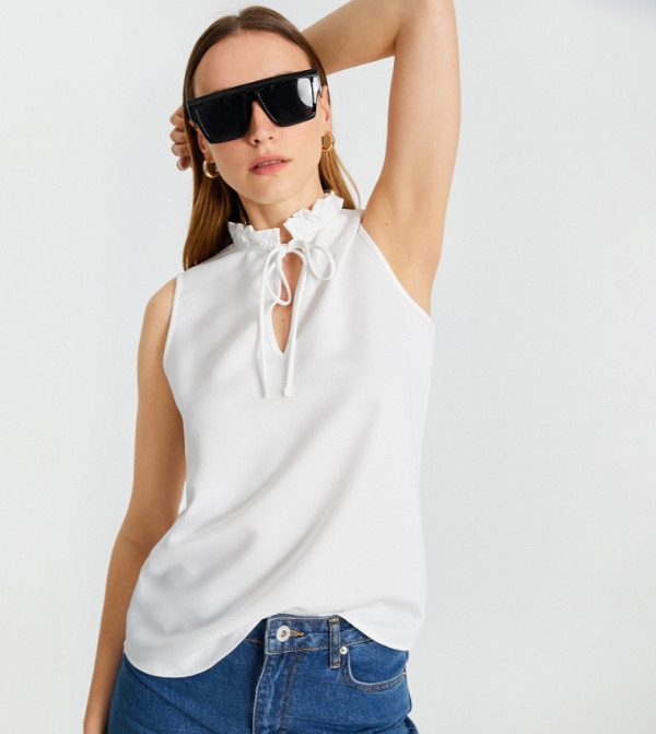 Solid Ruffle Tie-Up Neck Sleeveless Top