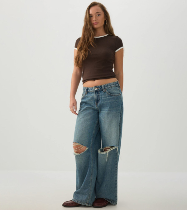 The Off-Duty Fit Distressed Low Rise Wide Leg Jeans