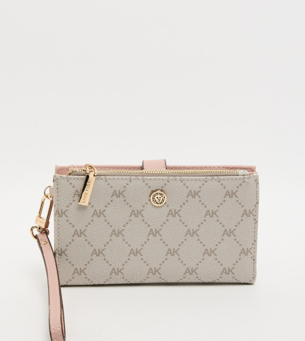 شنطة بمسكة يد بنقشة مونوغرام وسحاب 