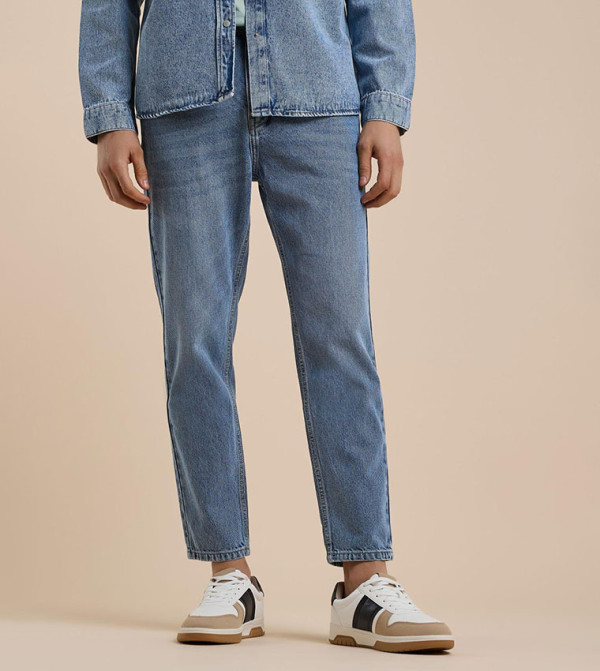 Washed Tapered Fit Jeans with Button Closure