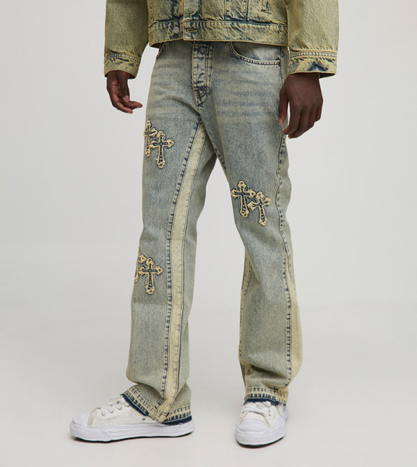 Cross Appliqued Slim Flared Paneled Jeans