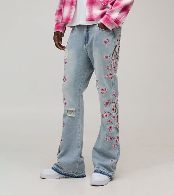 Floral Embroidered Distressed Let Down Hem Flared Jeans