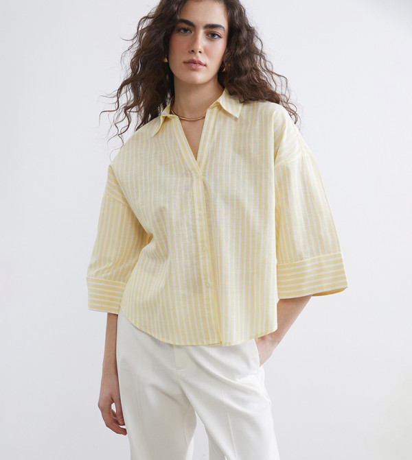 قميص واسع مخطط بكم ثلاثة أرباع