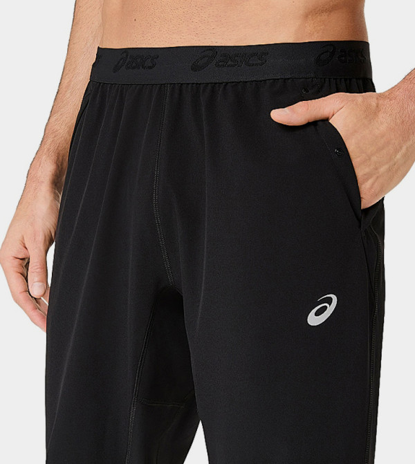 Asics  Track Pants & Joggers - BLACK Track Pants & Joggers