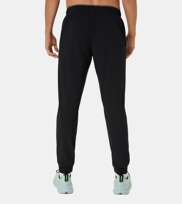 Asics  Track Pants & Joggers - BLACK Track Pants & Joggers