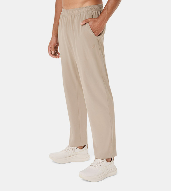 Asics  Track Pants & Joggers - Beige Track Pants & Joggers