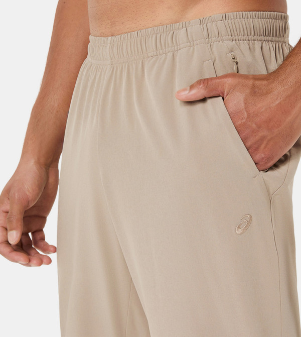 Asics  Track Pants & Joggers - Beige Track Pants & Joggers