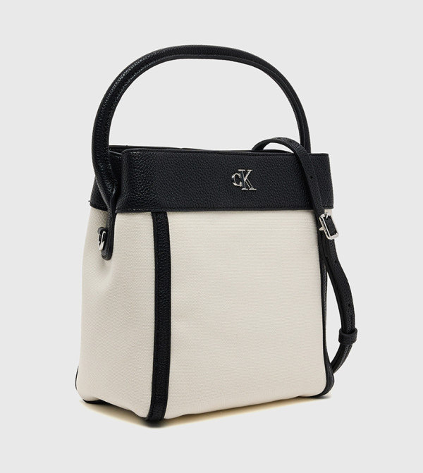 Calvin Klein Calvin Klein - Cream Handheld Bags