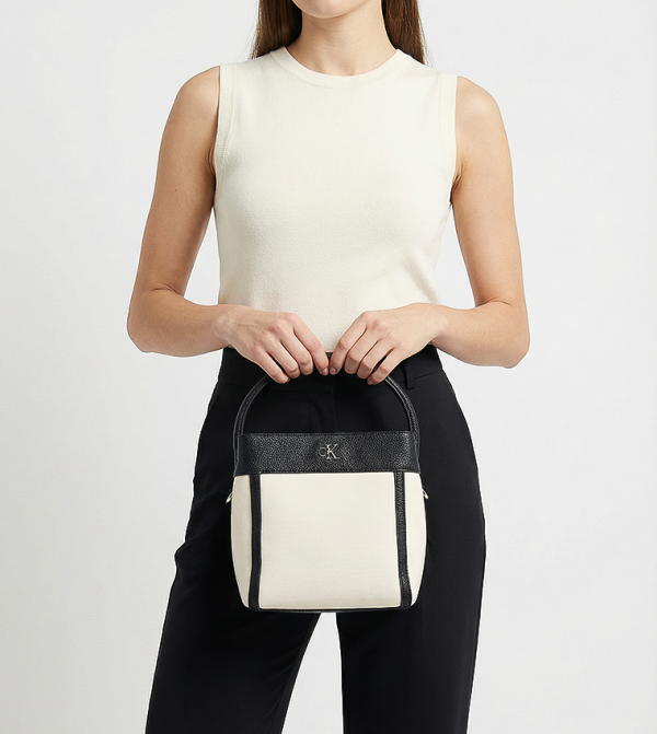 Calvin Klein Calvin Klein - Cream Handheld Bags
