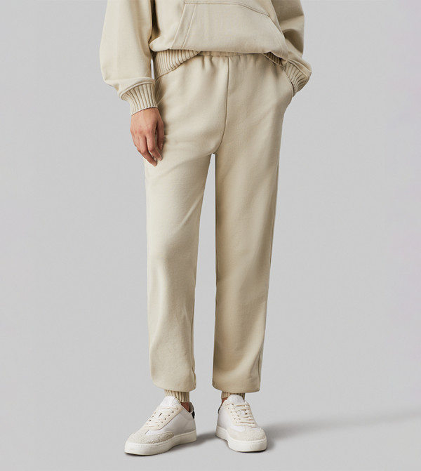 كالفن كلاين جينز  بناطيل مشي وركض - كريمي  Track Pants & Joggers