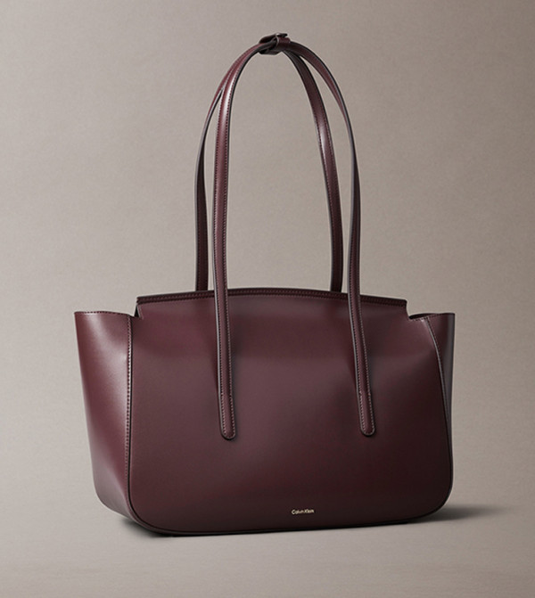 كالفين كلاين كالفين كلاين - بني محمر  حقائب يد كبيرة