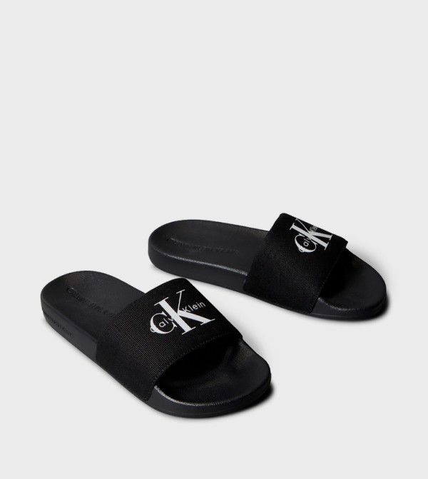 Calvin Klein  Flip flops and Slides - Black Slides
