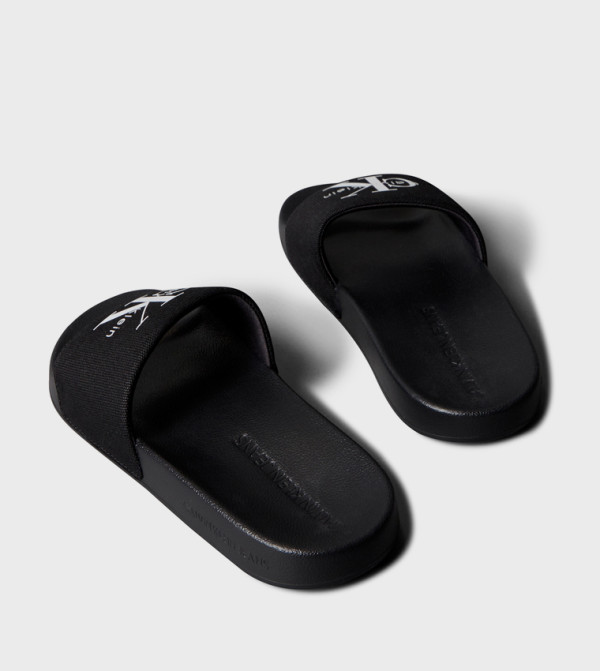 Calvin Klein  Flip flops and Slides - Black Slides