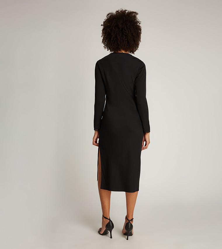 Buy Calvin Klein Solid Sheer Detail V Neck Midi Dress In Black | 6thstreet Oman Buy Calvin Klein Solid Sheer Detail V Neck Midi Dress In Black | 6thstreet Oman