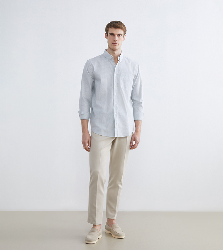 قميص مخطط بكم طويل وقصة عادية