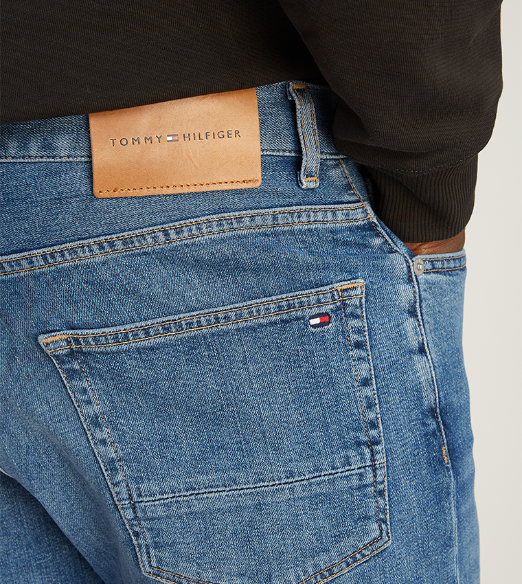 Washed Mid Rise Tapered Fit Jeans