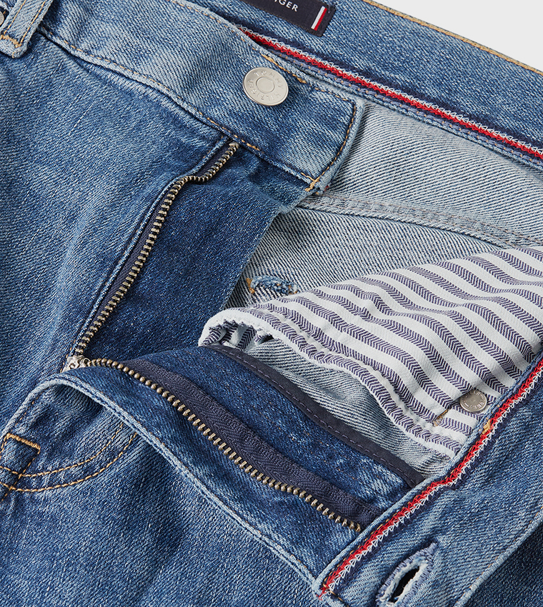 Washed Mid Rise Tapered Fit Jeans