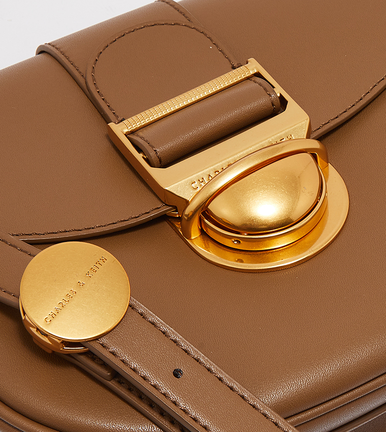 Buy Charles & Keith Amelia Metallic Push Lock Crossbody Bag In Brown