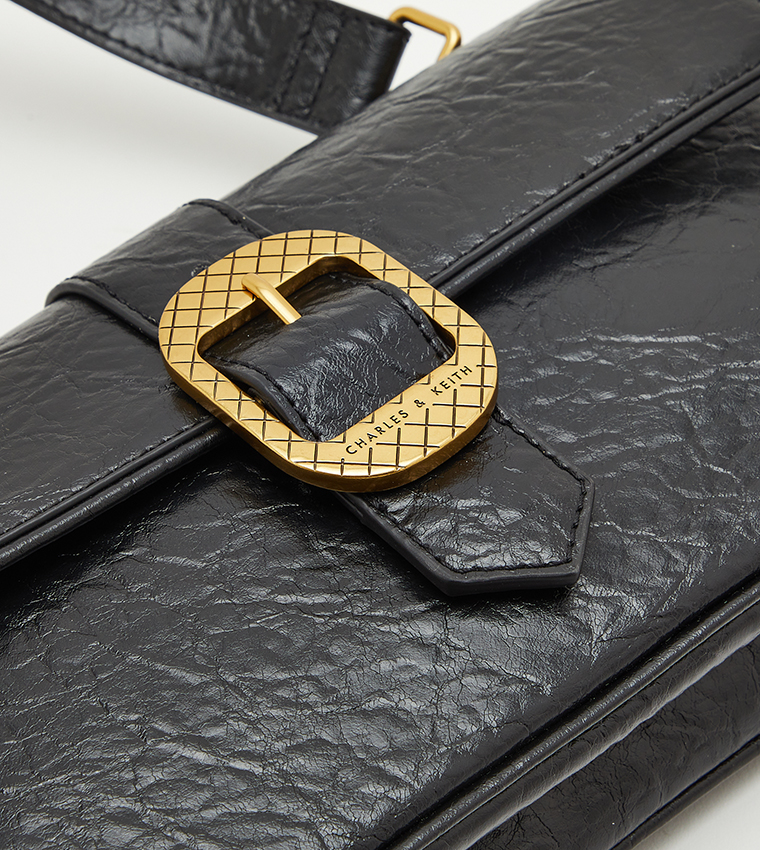 Charles & Keith shoulder bag in black with gold buckle