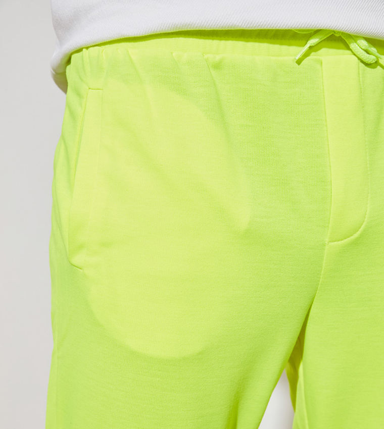 Buy Trendyol Solid Neon Slim Fit Sweatpants In Yellow 6thStreet Bahrain