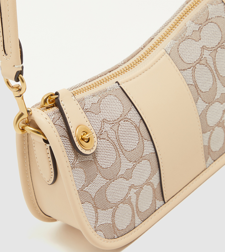 Buy COACH Textured Swinger Shoulder Bag In Beige | 6thStreet UAE