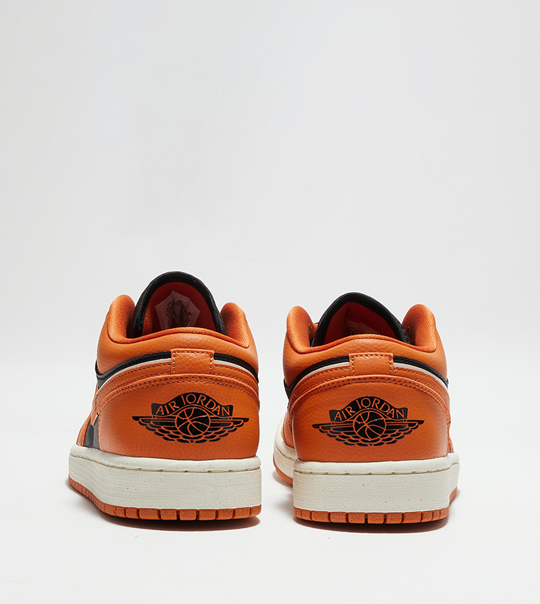 Orange low top top nikes