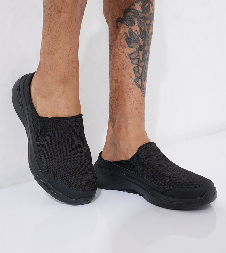 Buy Skechers Go Walk Arch Fit Slip On Clogs In Black 6thStreet UAE