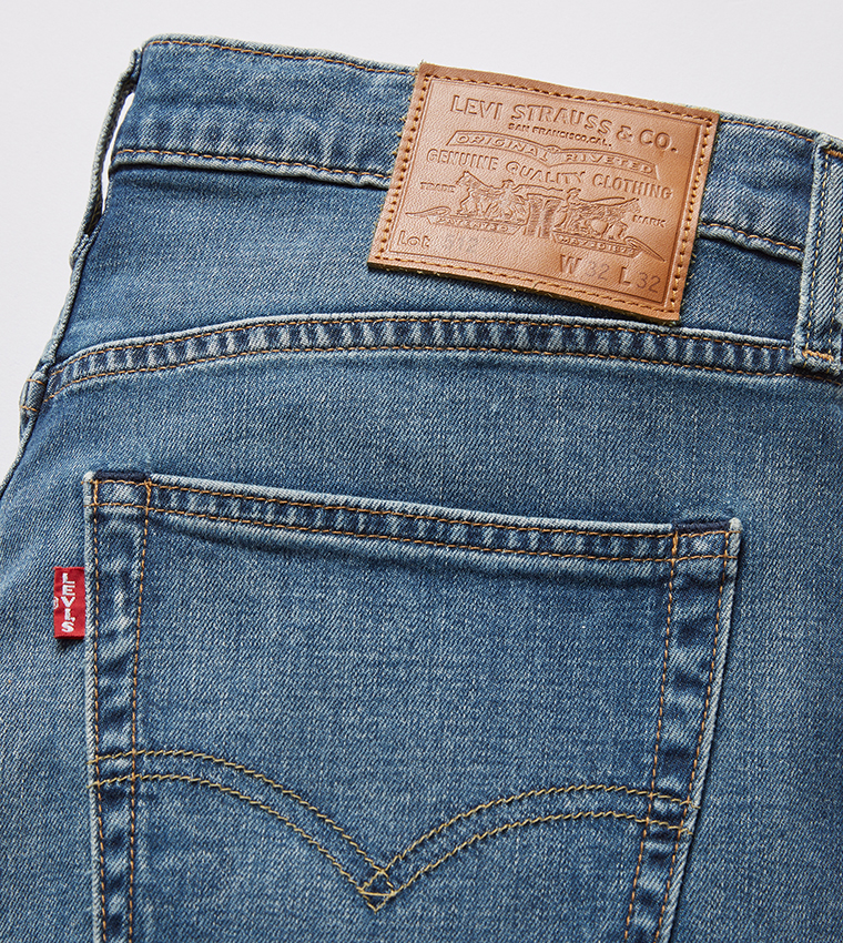512™ Mid Tapered Jeans