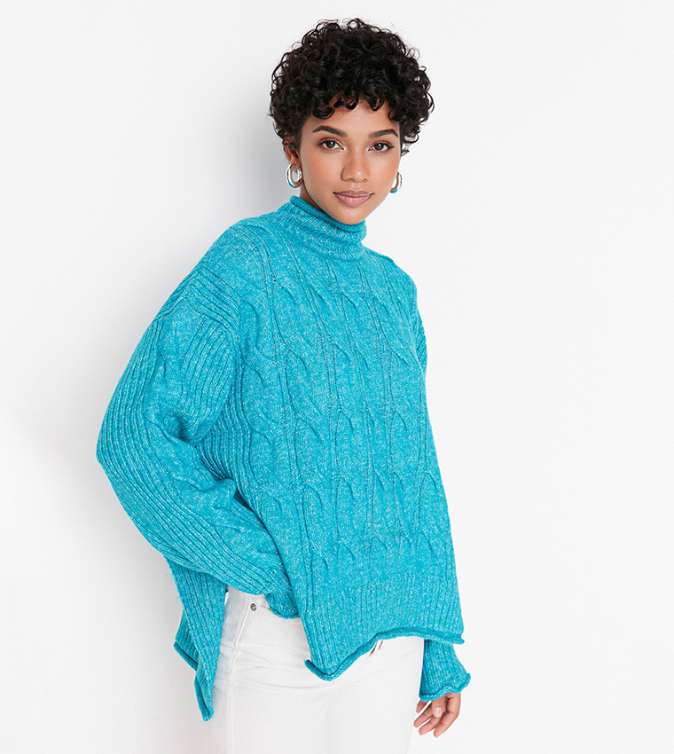bright turquoise sweater