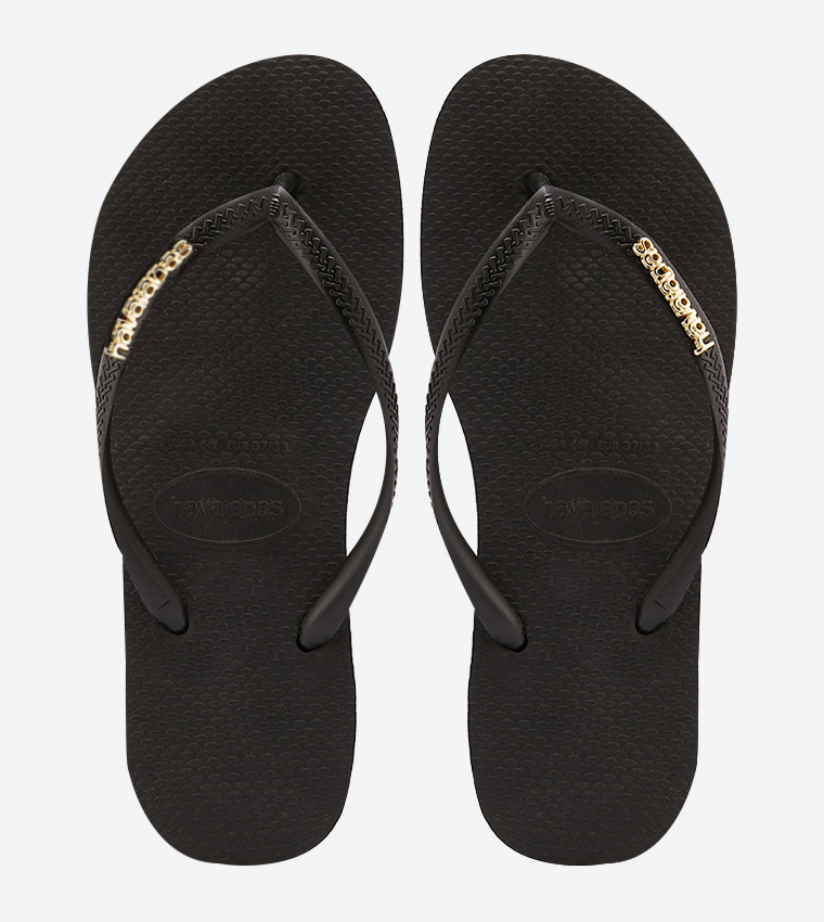 Black havaianas with store silver logo