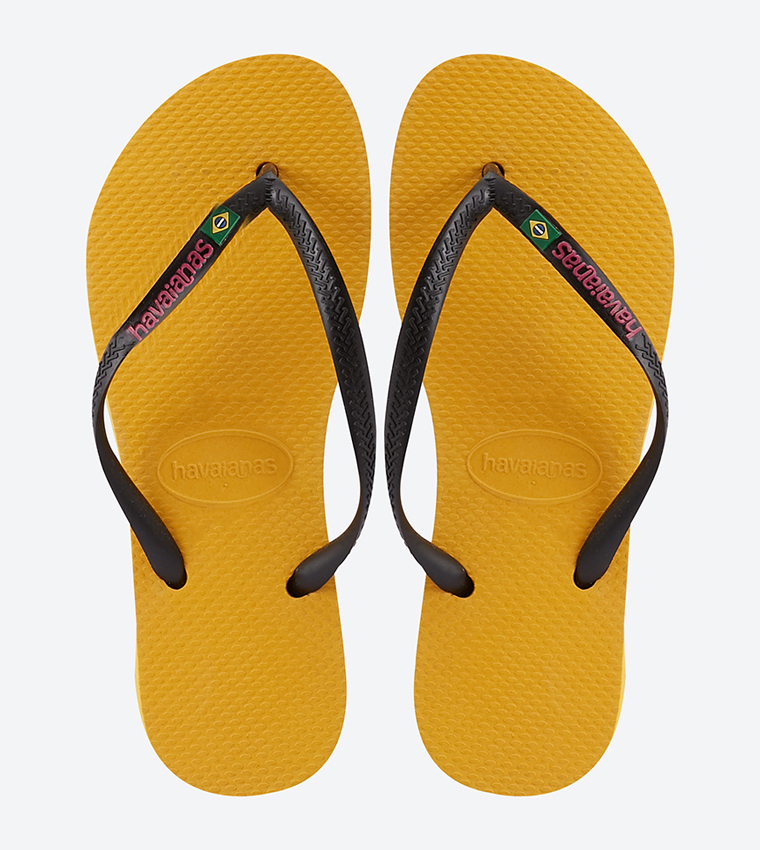 Buy Havaianas Slim Brasil Logo Flip Flops In Yellow 6thStreet UAE