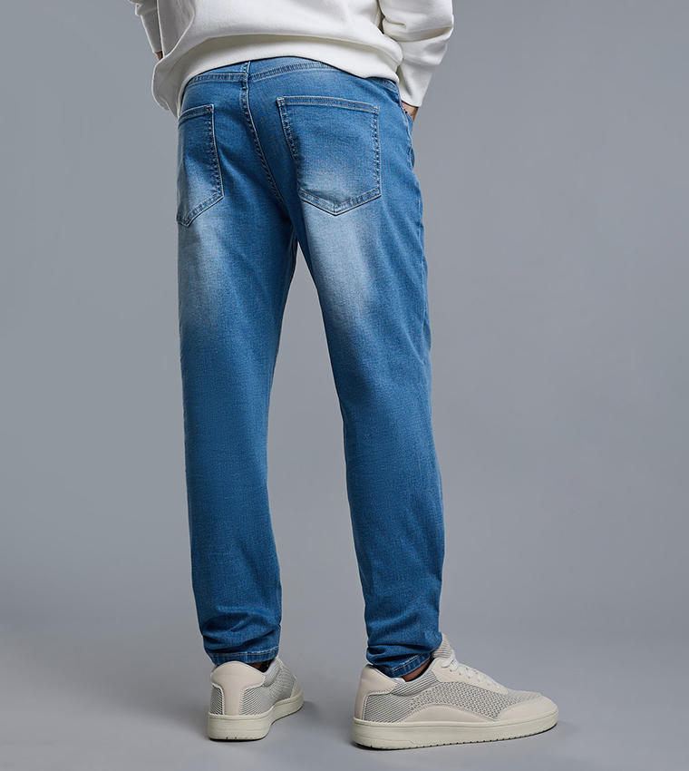Faded Carrot Fit Jeans with Button Closure