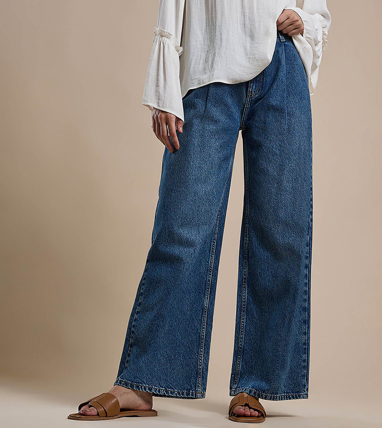 Faded Pleated Jeans with Button Closure