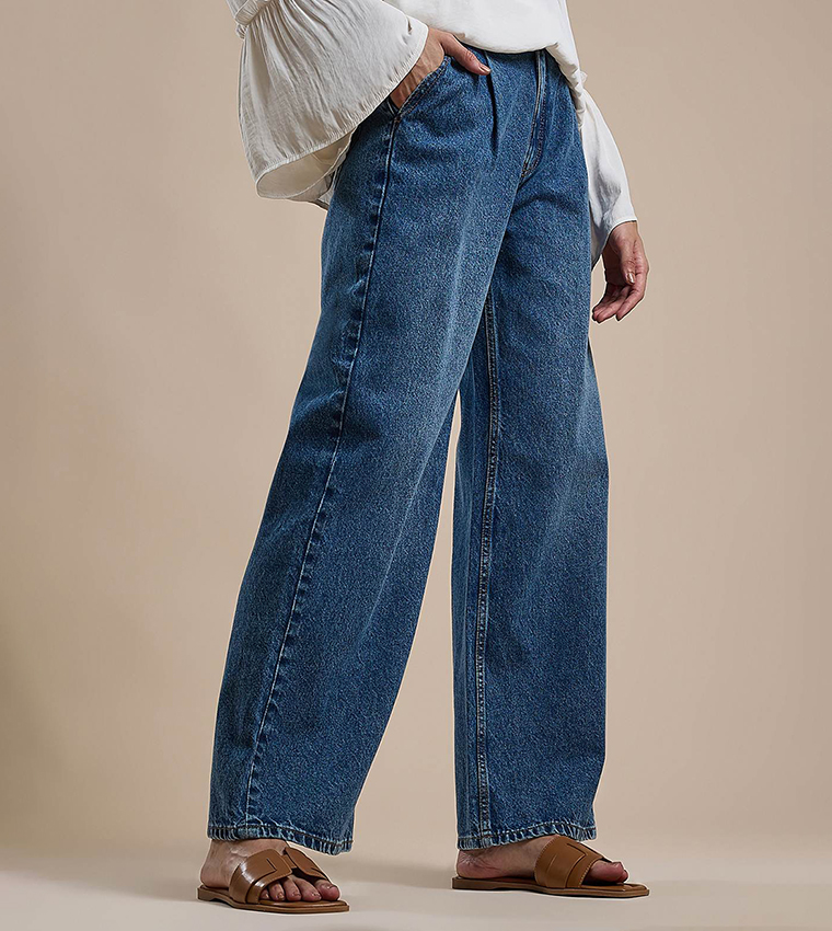 Faded Pleated Jeans with Button Closure