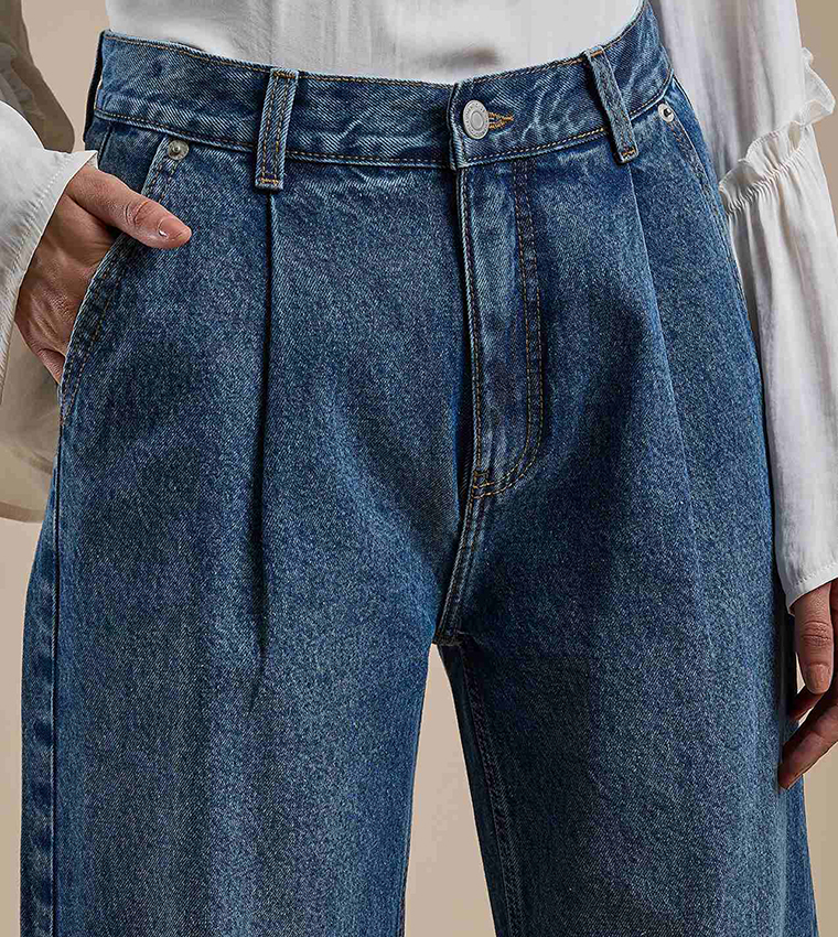 Faded Pleated Jeans with Button Closure
