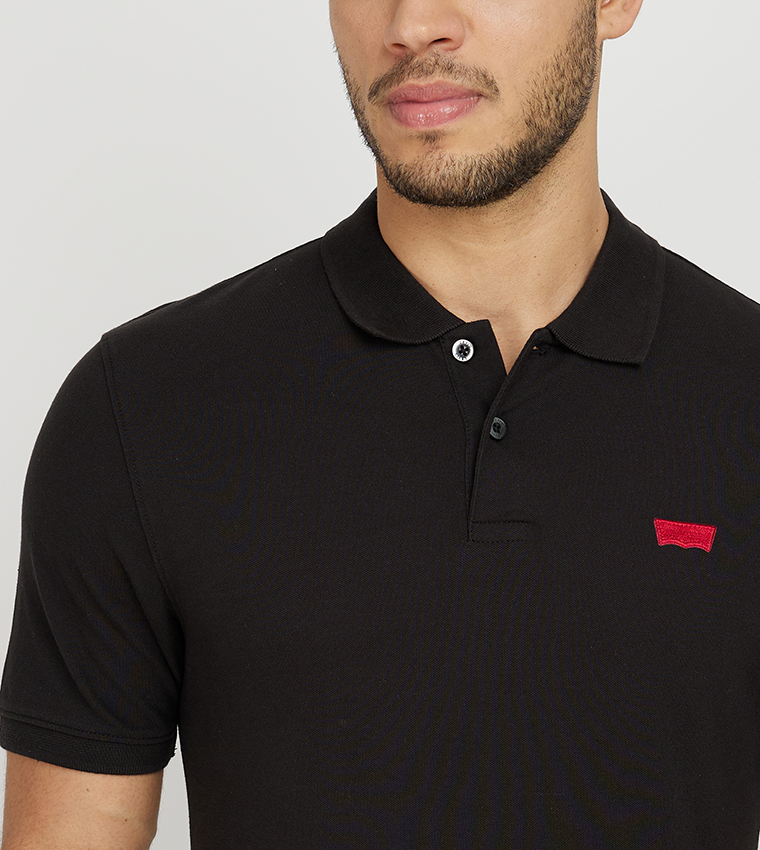 Buy Levi s Logo Detail Slim Fit Polo T Shirt In Black 6thStreet Saudi Arabia