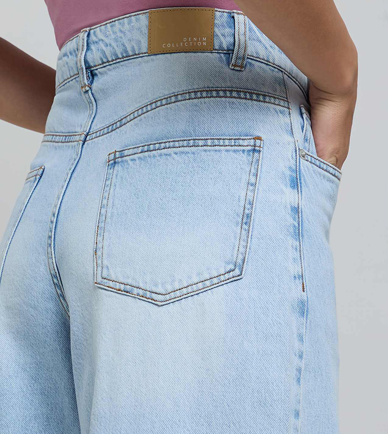 Faded Wide Leg Jeans with Button Closure