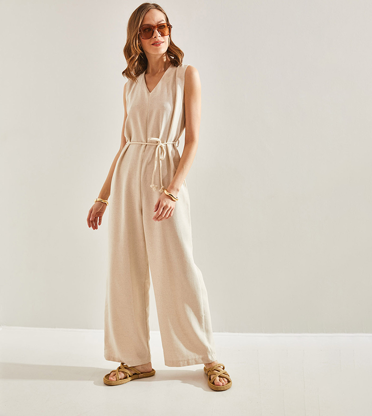 Buy Bianco Lucci Belted V Neck Sleeveless Jumpsuit In Beige | 6thStreet  Bahrain